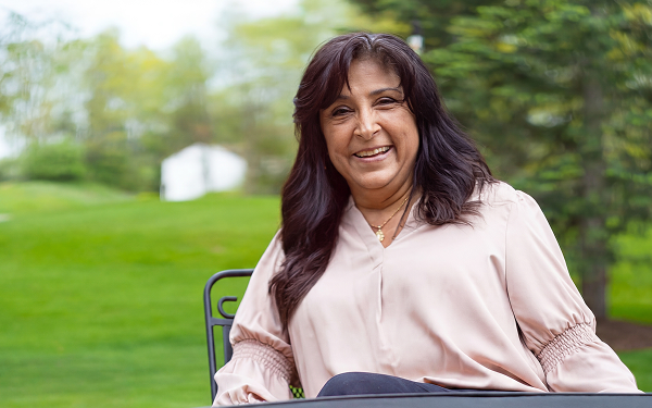 See the VALOR Study Results Veronica, a real patient taking LISRAYA for dermatomyositis, smiling while seated outdoors